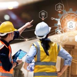 Engineer and Architect analysing of under construction project with technology and new innovative on digital tablet and icon network of construction on virtual interface