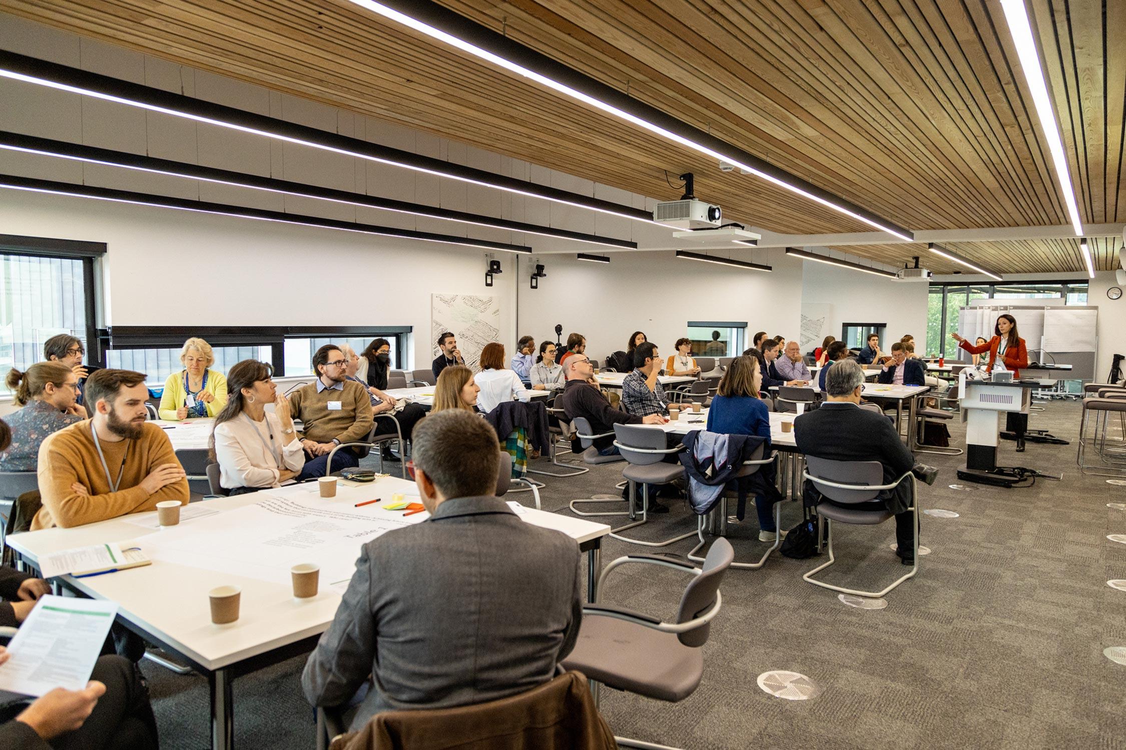 Room full of people set up in focus group format