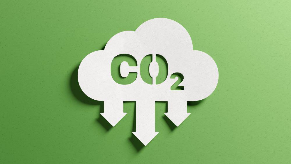 About Us o Reduce CO2 emissions to limit climate change and global warming. Low greenhouse gas levels, decarbonize, net zero carbon dioxide footprint. Abstract minimalist design, cutout paper, green background.