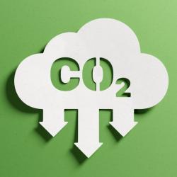o	Reduce CO2 emissions to limit climate change and global warming. Low greenhouse gas levels, decarbonize, net zero carbon dioxide footprint. Abstract minimalist design, cutout paper, green background.